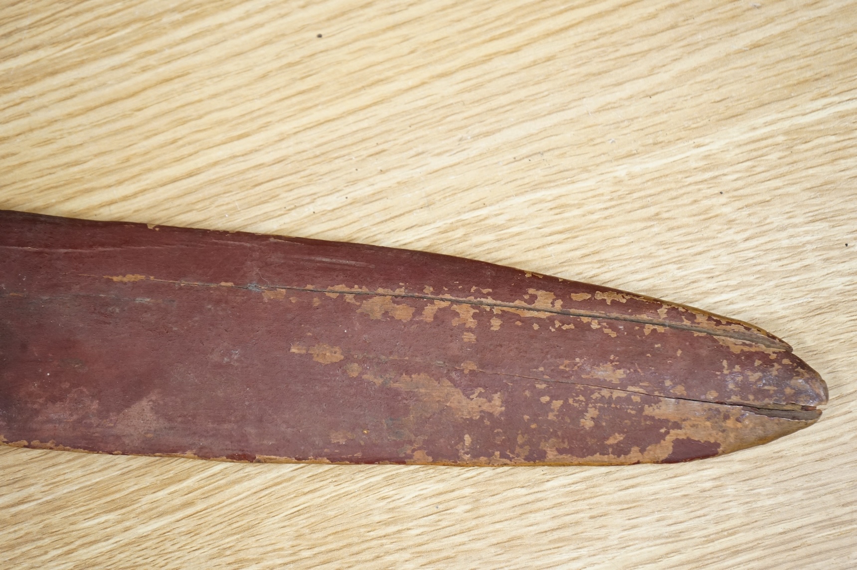 An Australian aboriginal boomerang, 56cm wide, collected in Australia c.1945